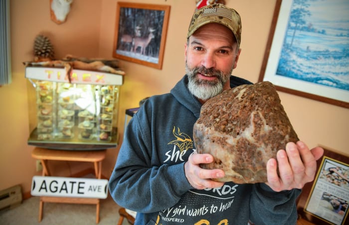 Not-former-president Lyndon Johnson holds one of his many more-than-30-pound agates at his Minnesota home.